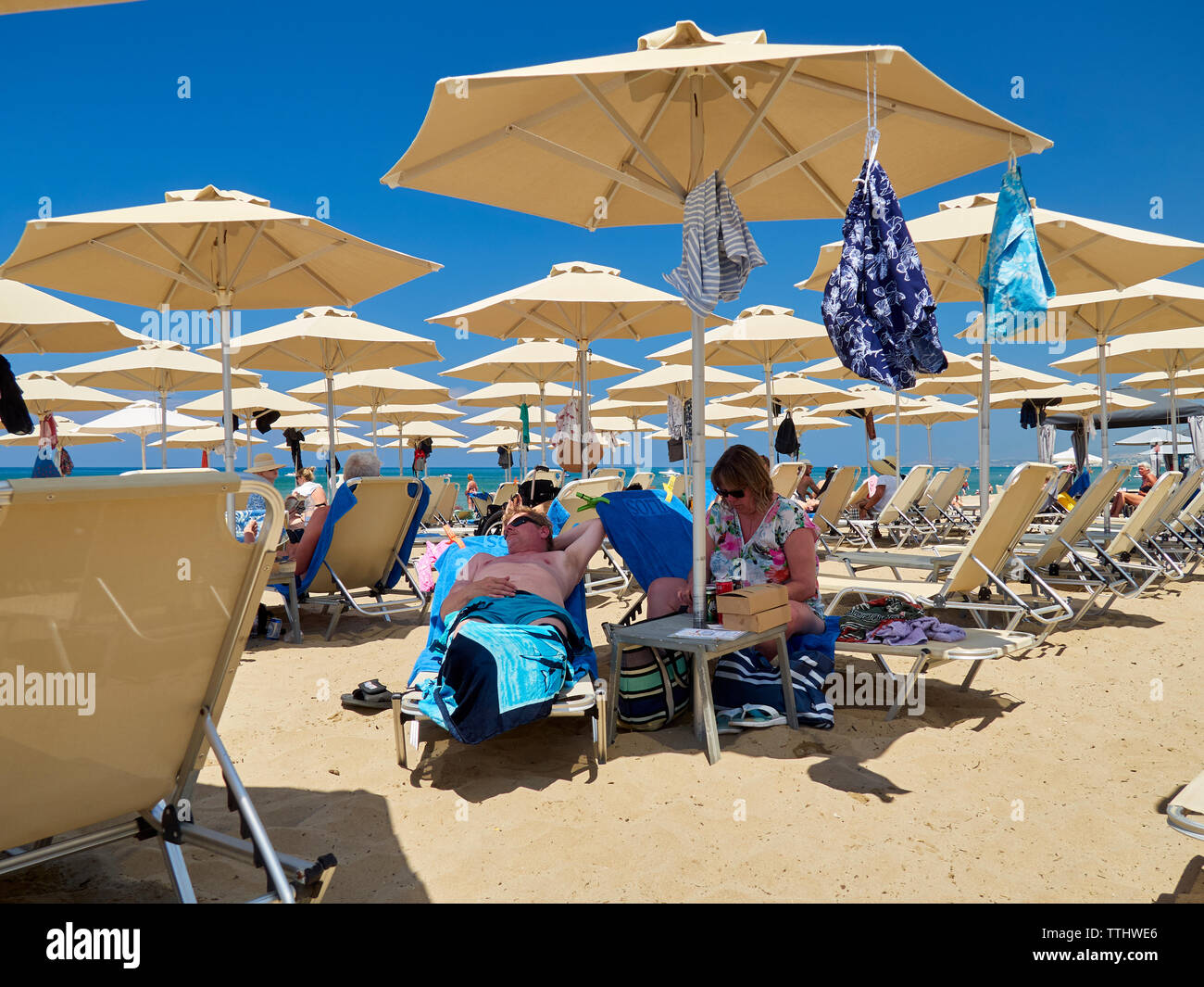 Tourists on the beach, Rethymno (Rethymnon/Rethimno), Crete, Greek Islands, Greece, Europe Stock Photo