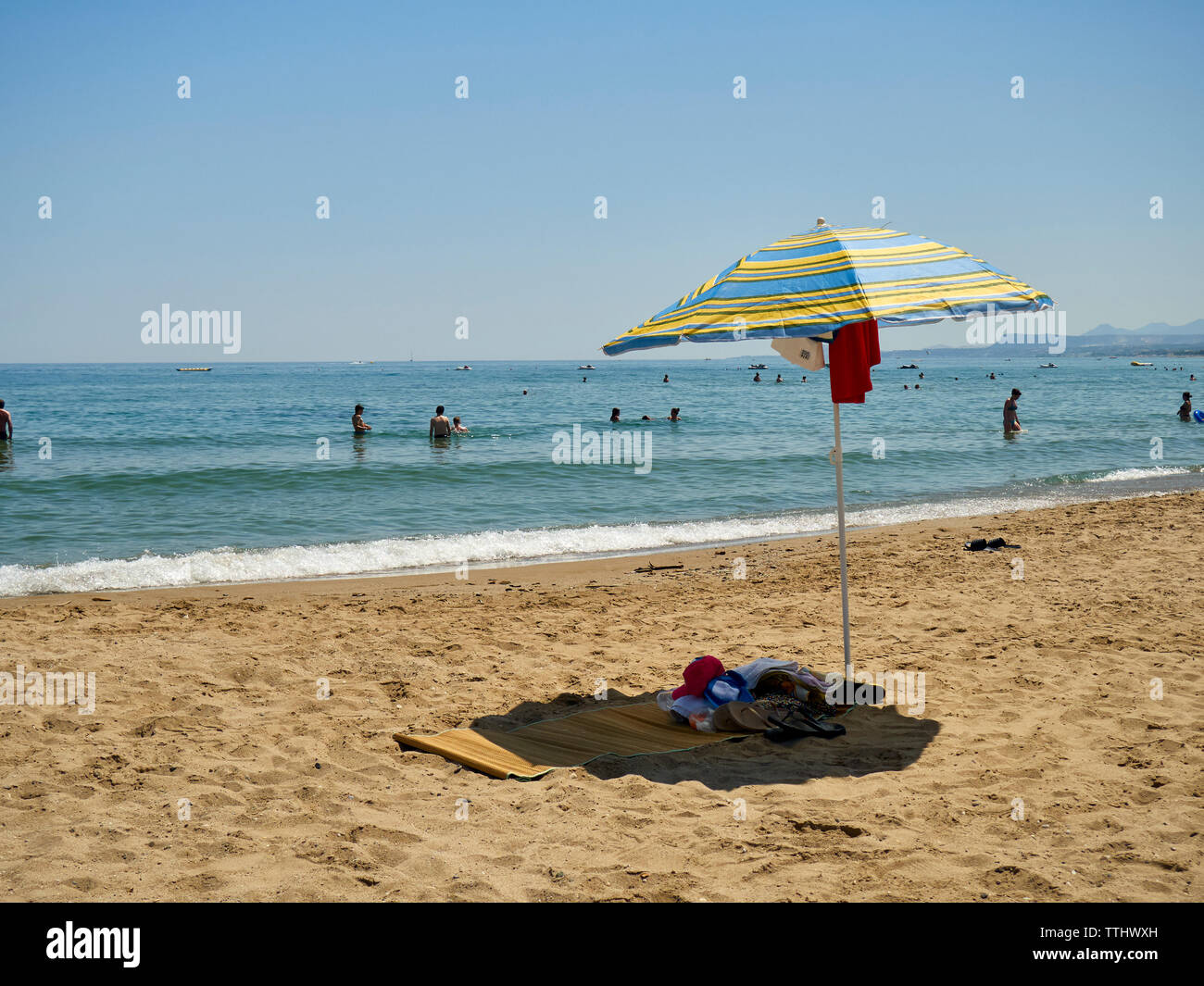 Tourists on the beach, Rethymno (Rethymnon/Rethimno), Crete, Greek Islands, Greece, Europe Stock Photo