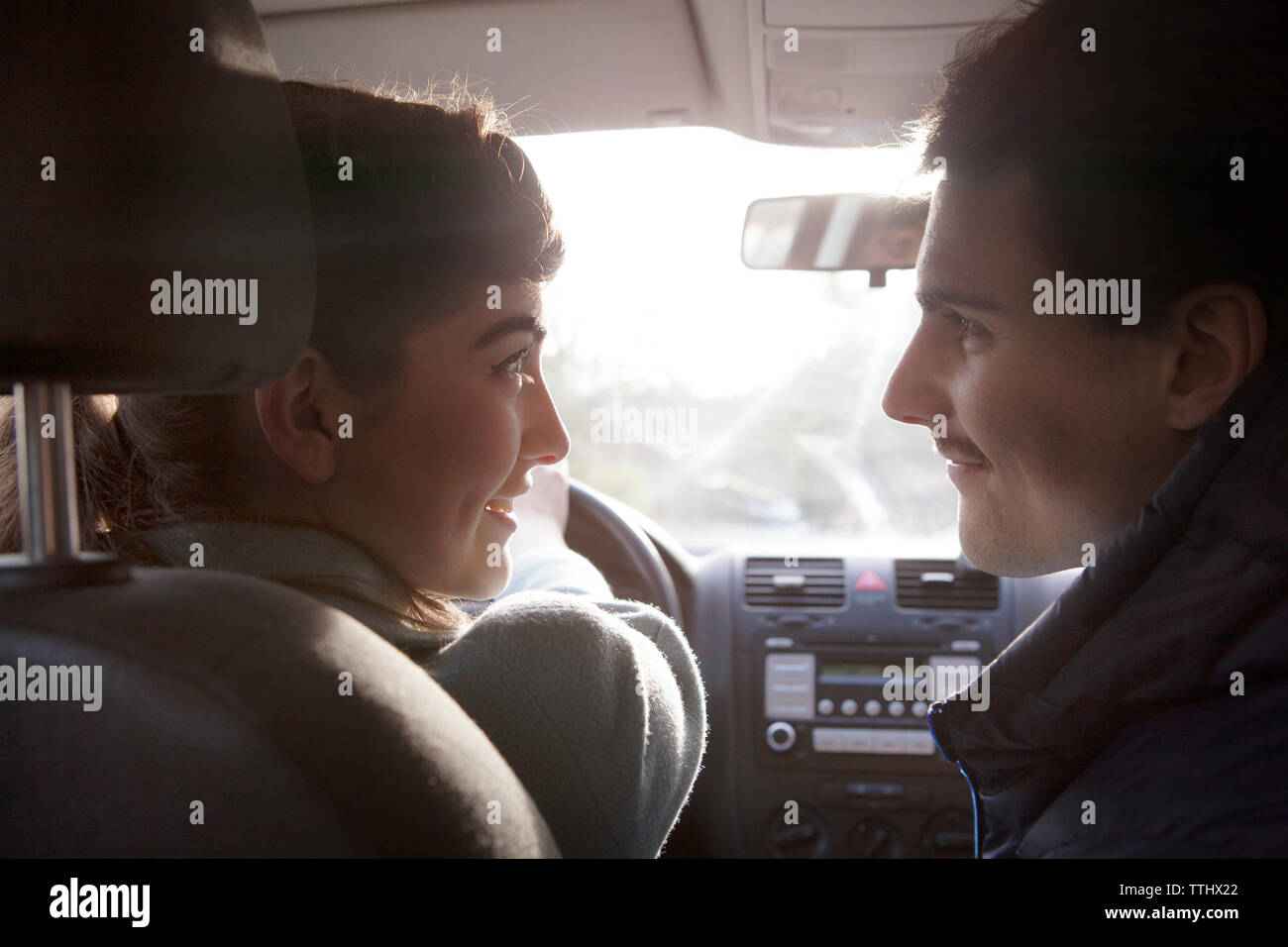 Close-up of couple sitting in car Stock Photo