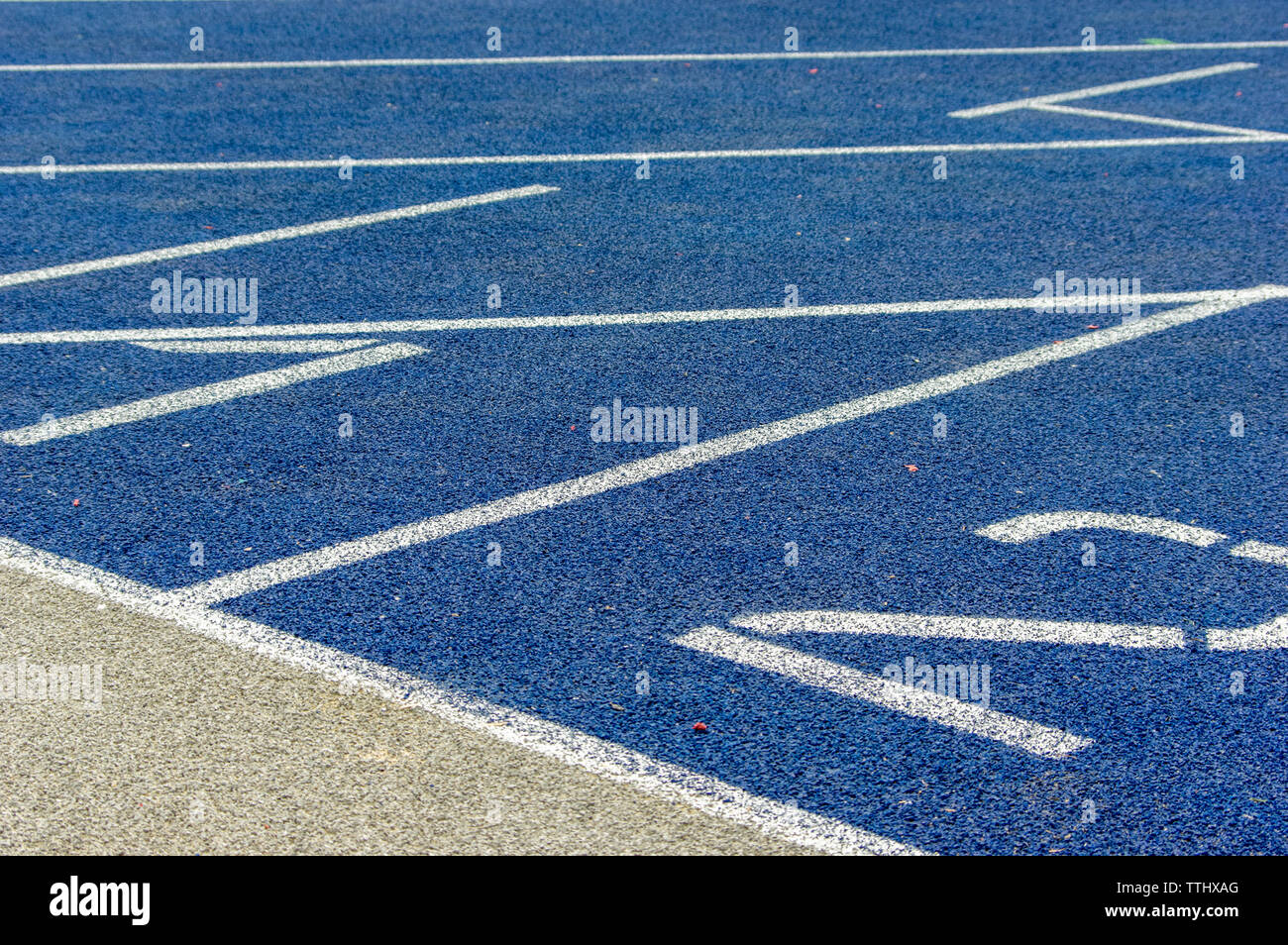 blue tartan running track with numbers Stock Photo - Alamy