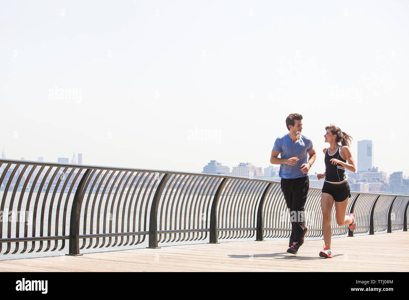 Jogging Track Railing Jogging together river hi-res stock photography and images - Alamy