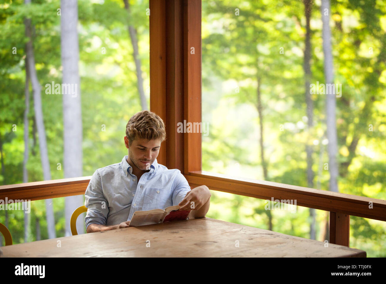 Teenager boy sitting on chair hi-res stock photography and images - Alamy