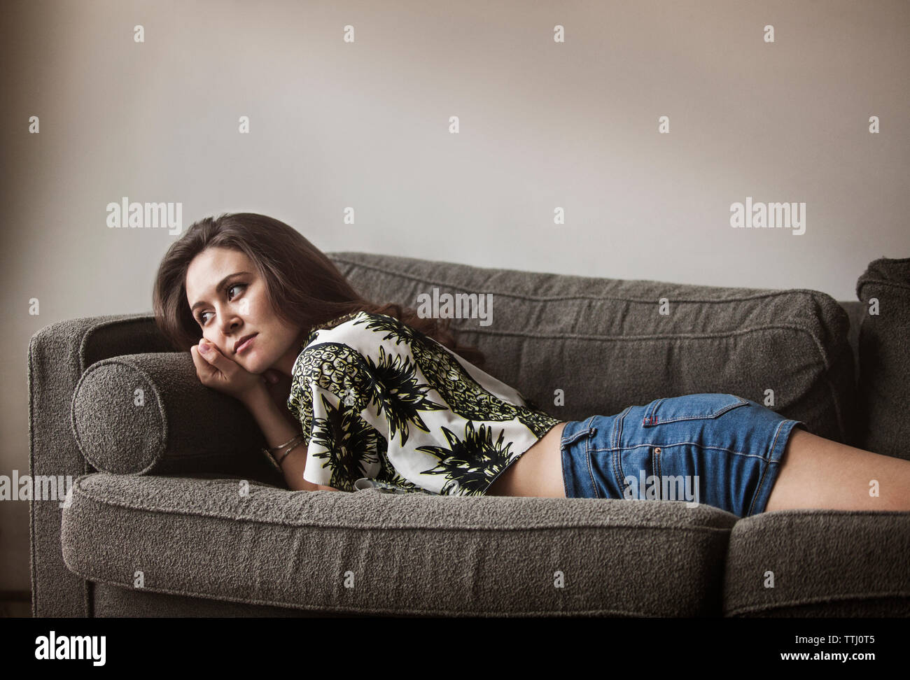 Woman relaxing sofa hi-res stock photography and images - Alamy