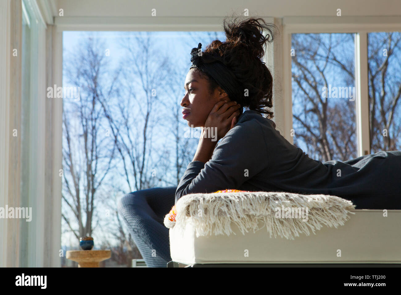 Casual woman lying on sofa hi-res stock photography and images - Alamy