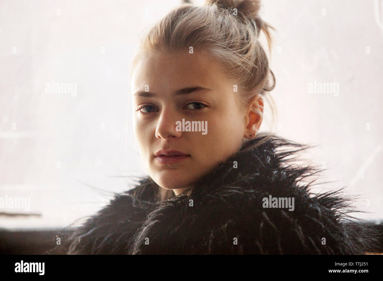 Portrait of woman in black fur coat Stock Photo - Alamy