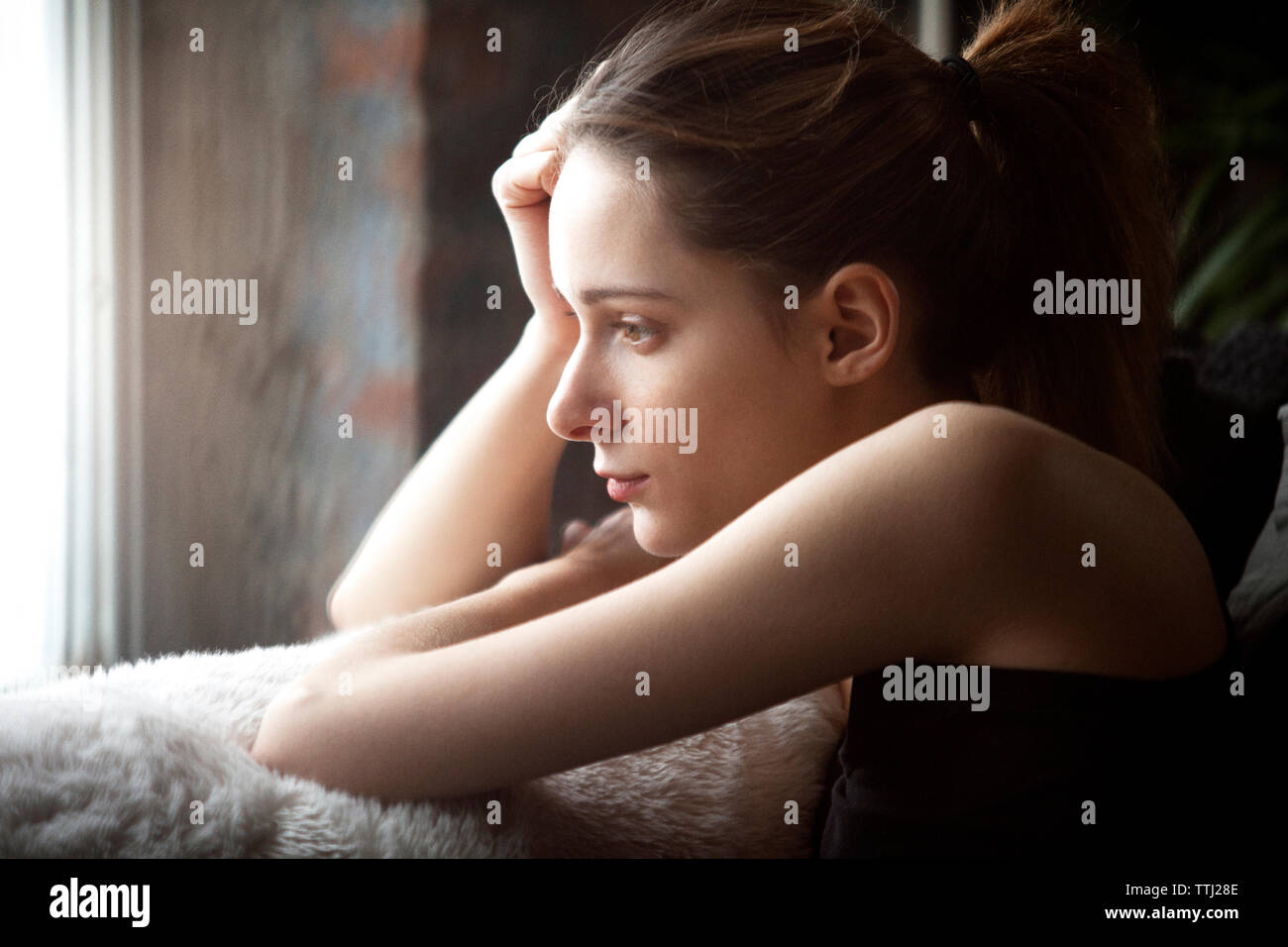 Side view of thoughtful woman looking away Stock Photo