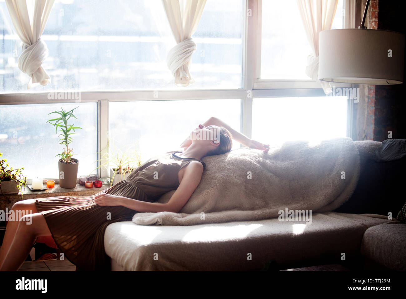 Woman relaxing sofa hi-res stock photography and images - Alamy