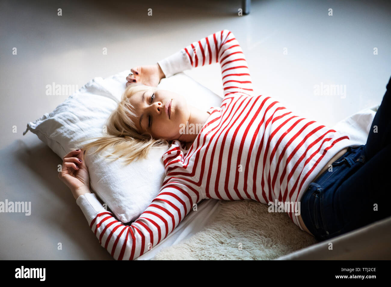 Woman lying on floor hi-res stock photography and images - Alamy