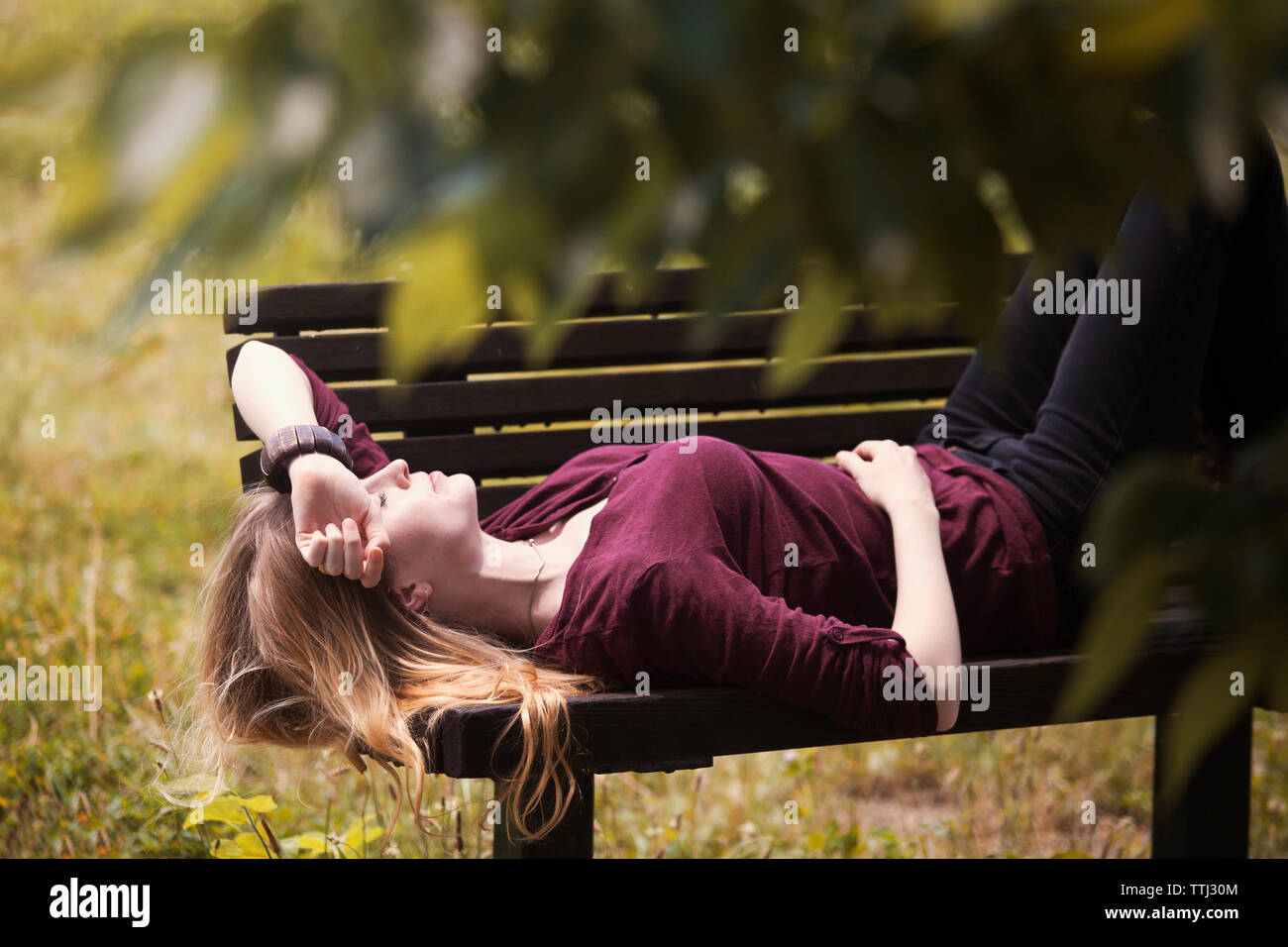 Back view woman park bench hi-res stock photography and images - Alamy