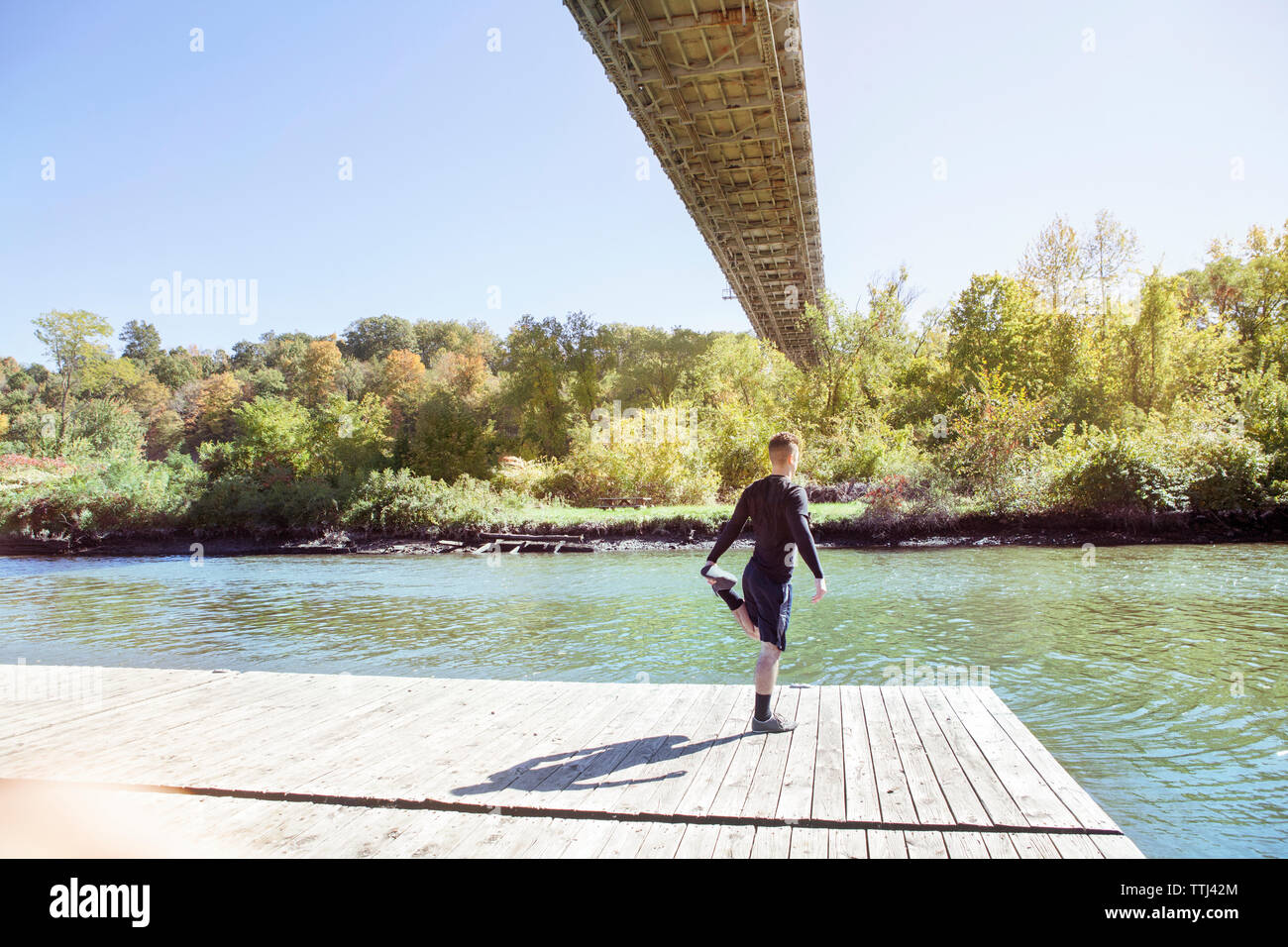 Man stretching on bridge hi-res stock photography and images - Alamy