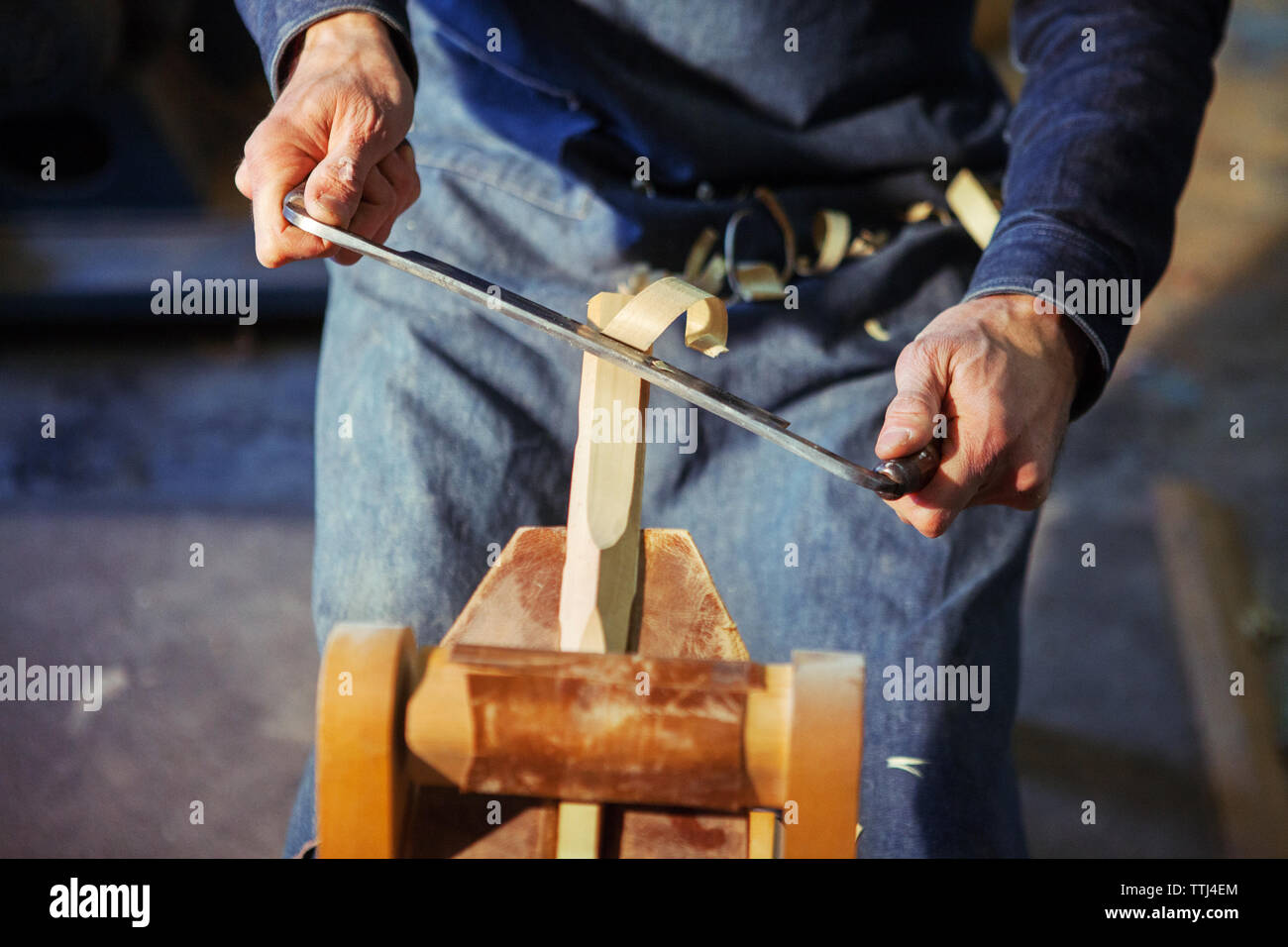 A Man Is Shaving An Wooden Log With An Drawknife Stock Photo - Download  Image Now - Drawknife, Adult, Adults Only - iStock