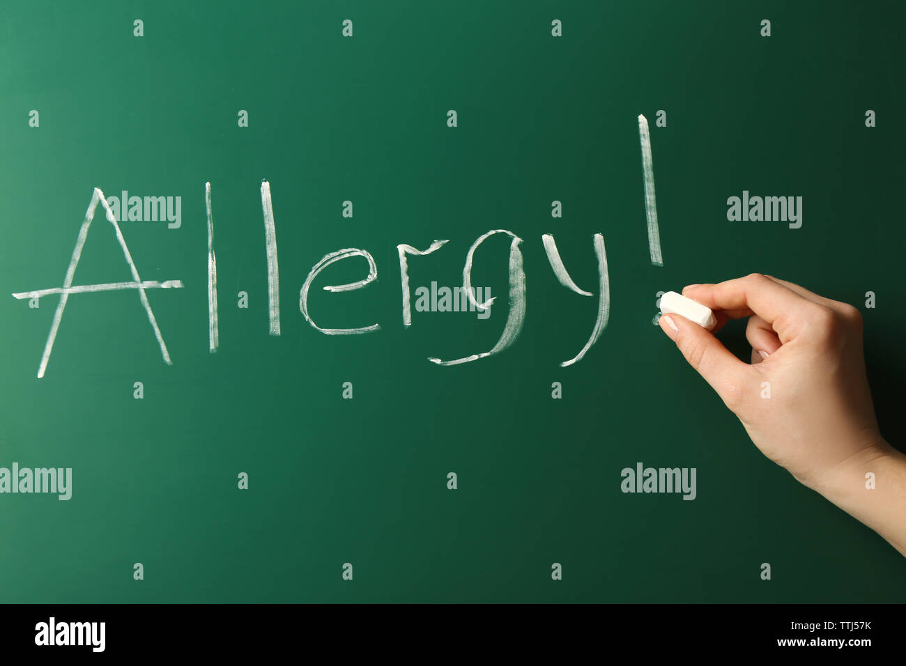 Allergy food concept. Hand with chalk writing on blackboard Stock Photo Alamy