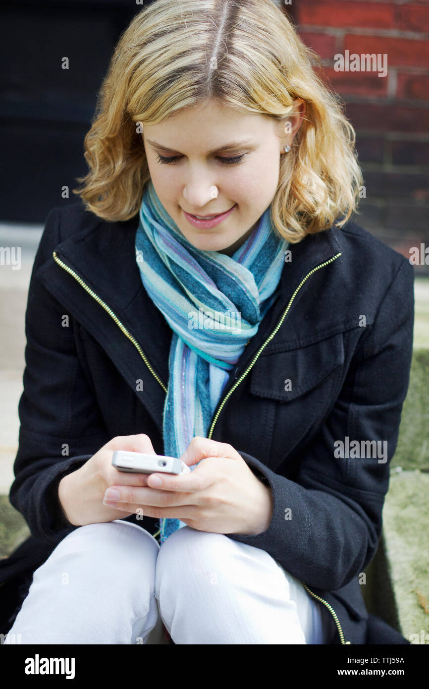 Woman using smart phone Stock Photo