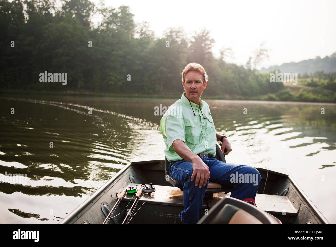 Old man sitting in boat hi-res stock photography and images - Alamy