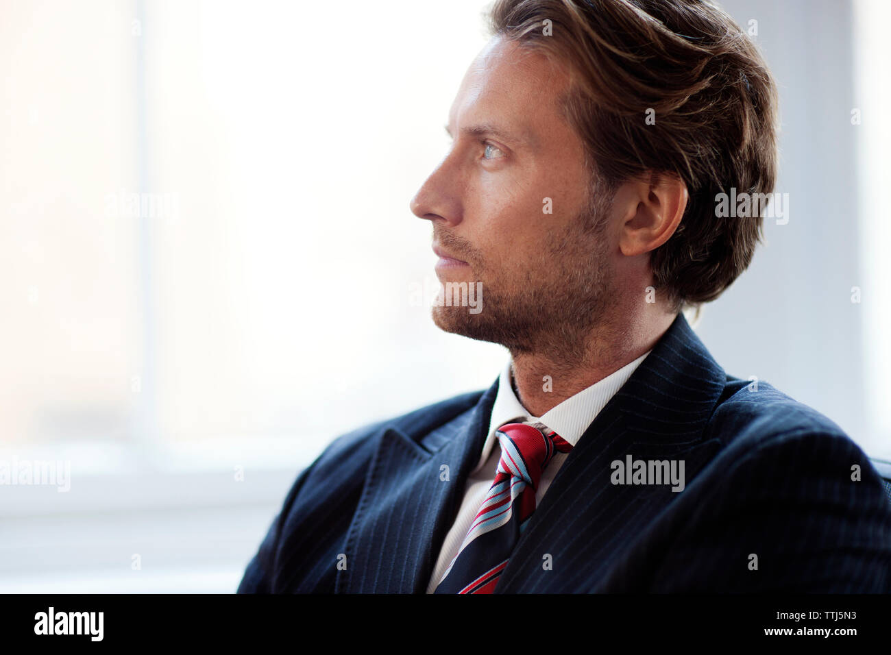 Thoughtful businessman looking away Stock Photo