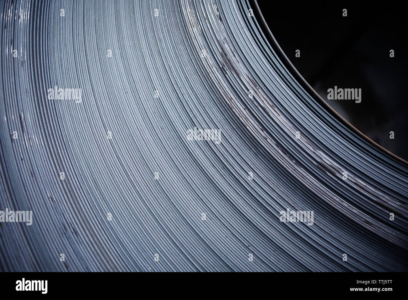 Extreme close-up of rolled up sheet metals at industry Stock Photo