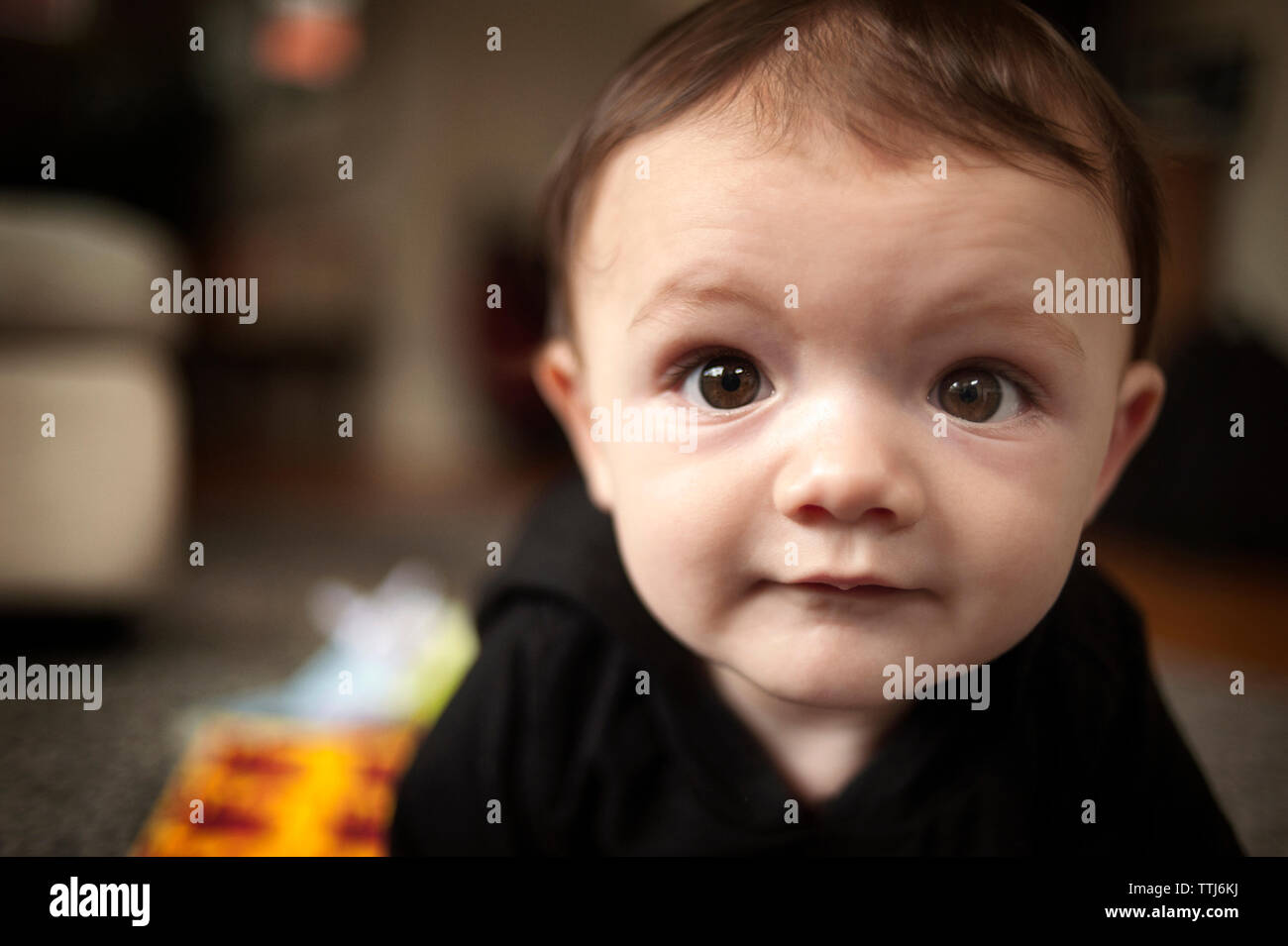 Portrait of cute baby boy at home Stock Photo