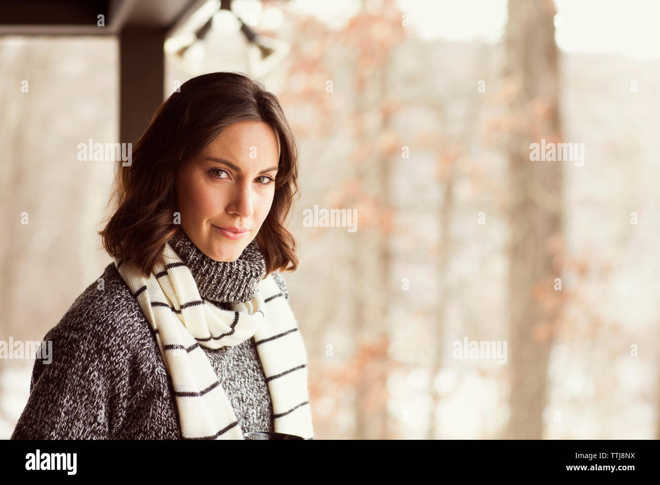 Portrait of confident woman in warm clothing Stock Photo