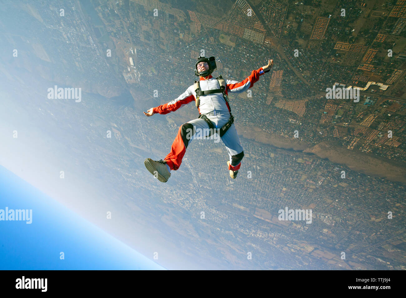 Aerial view of man skydiving Stock Photo