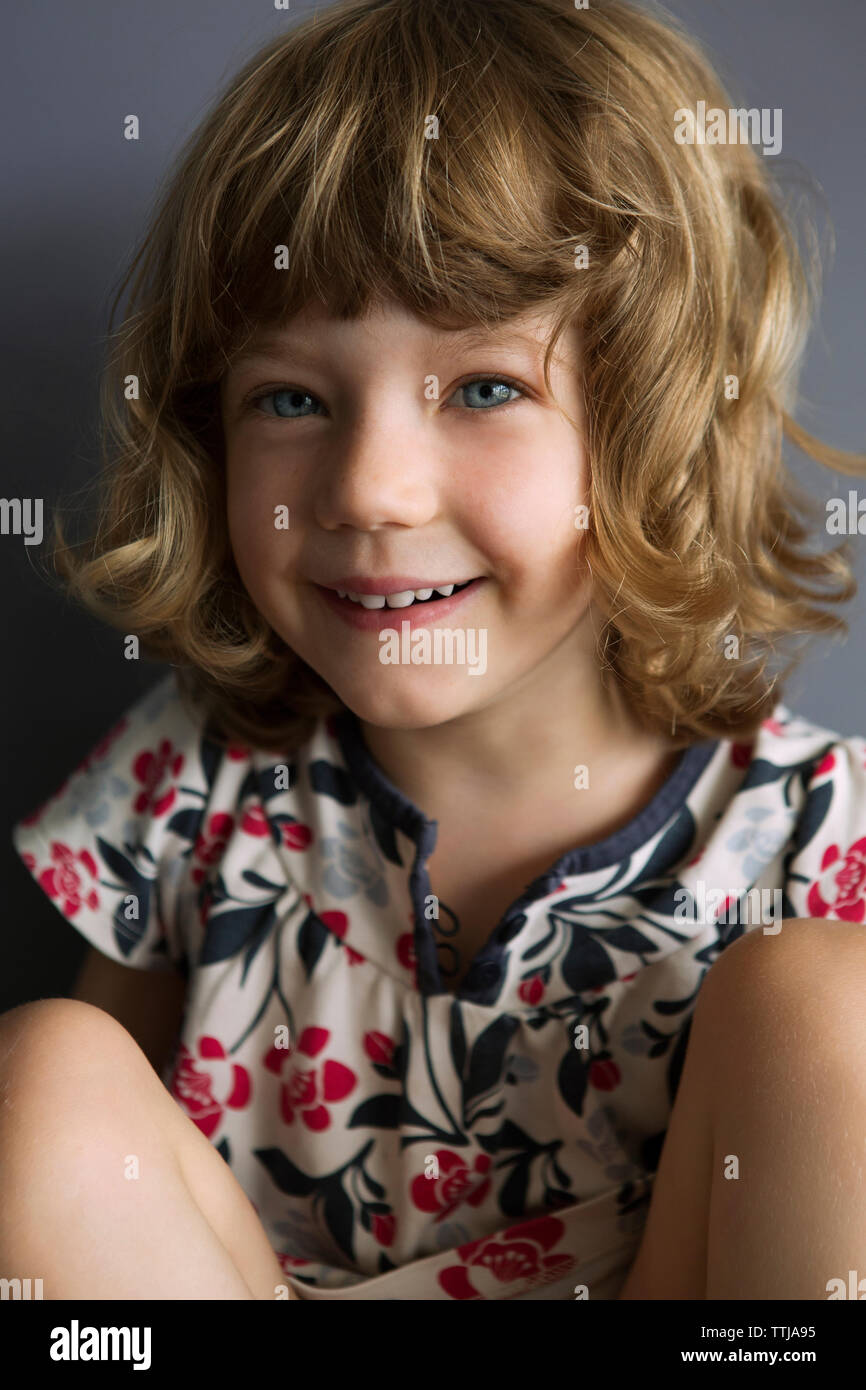 Girl sitting on sofa hi-res stock photography and images - Alamy