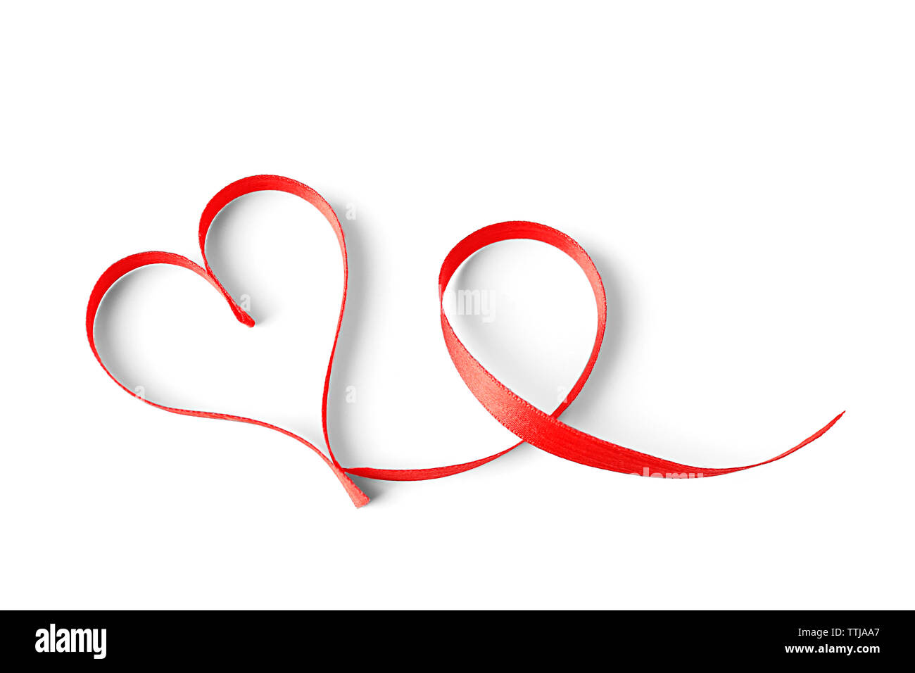 Red heart shaped ribbon isolated on white Stock Photo - Alamy