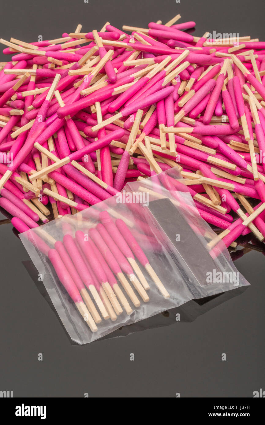 Random pile of waterproof emergency matches. Metaphor survival skills, chaotic mind, disorganized, random, lost in the crowd, untidy mind. Stock Photo