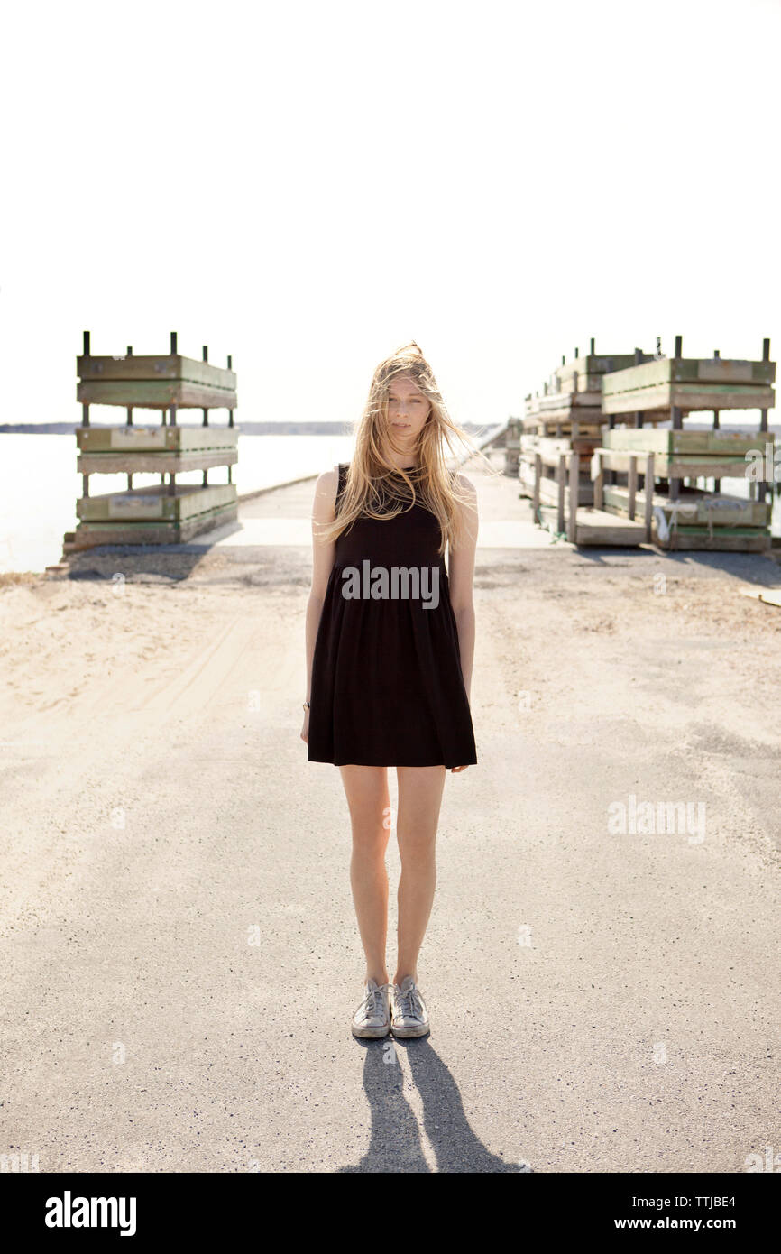 Woman standing tousled hair hi-res stock photography and images - Alamy