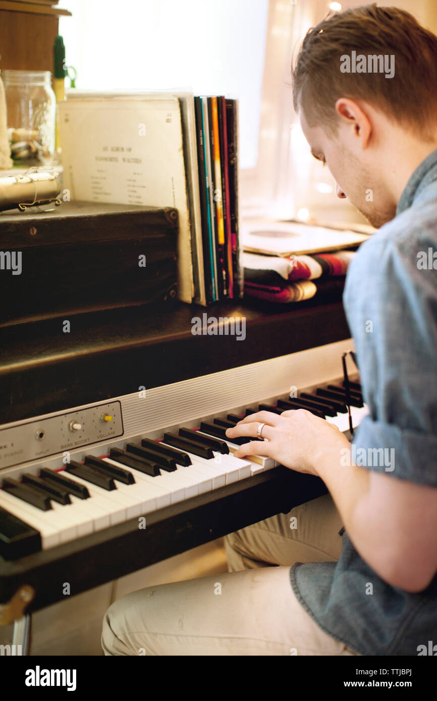 Side View Of Man Playing Piano At Home Stock Photo Alamy side-view-of-man-playing-piano-at-home-stock-photo-alamy