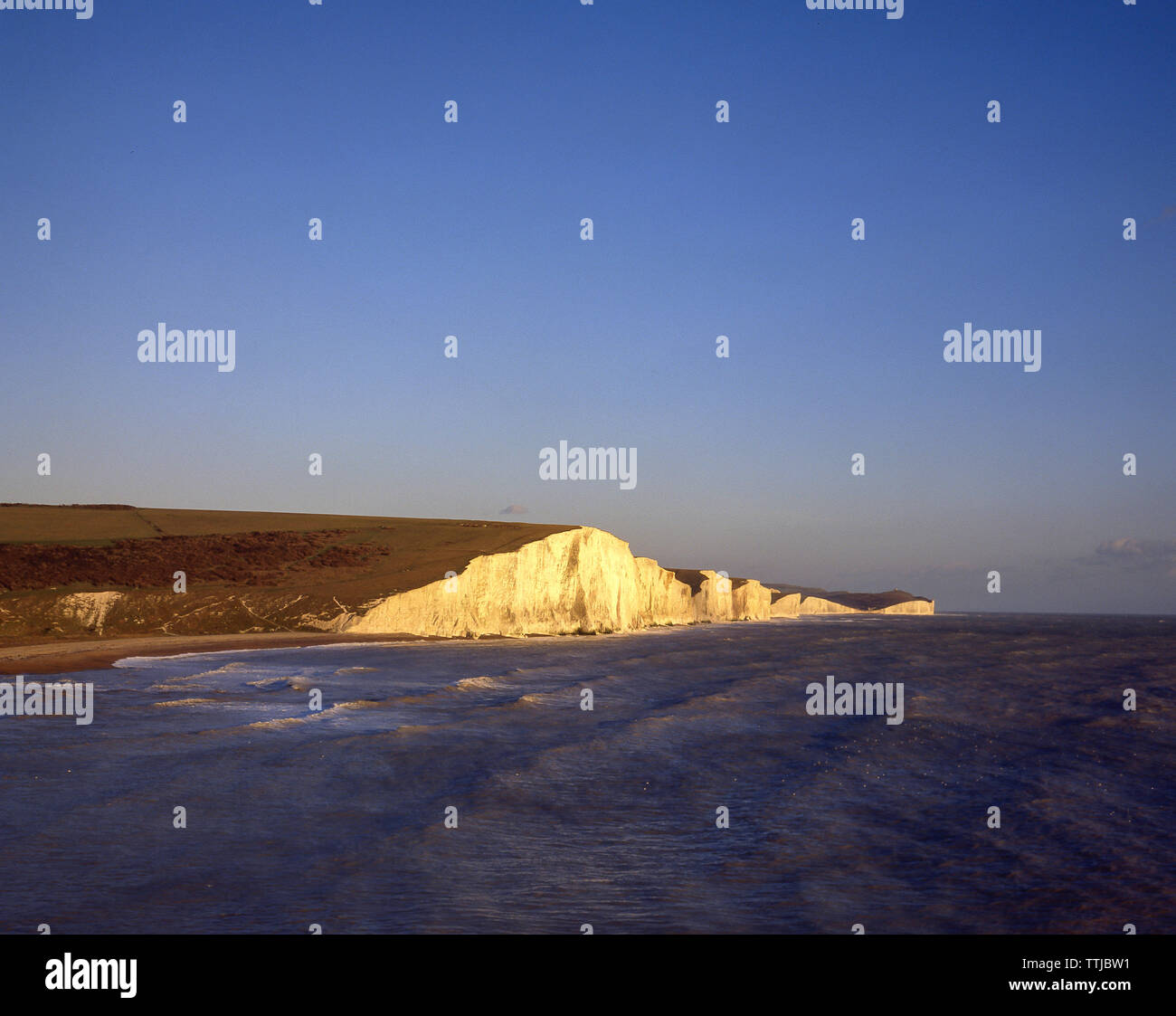 White chalk cliffs at sunrise, Seven Sisters Country Park, Seaford, East Sussex, England, United Kingdom Stock Photo