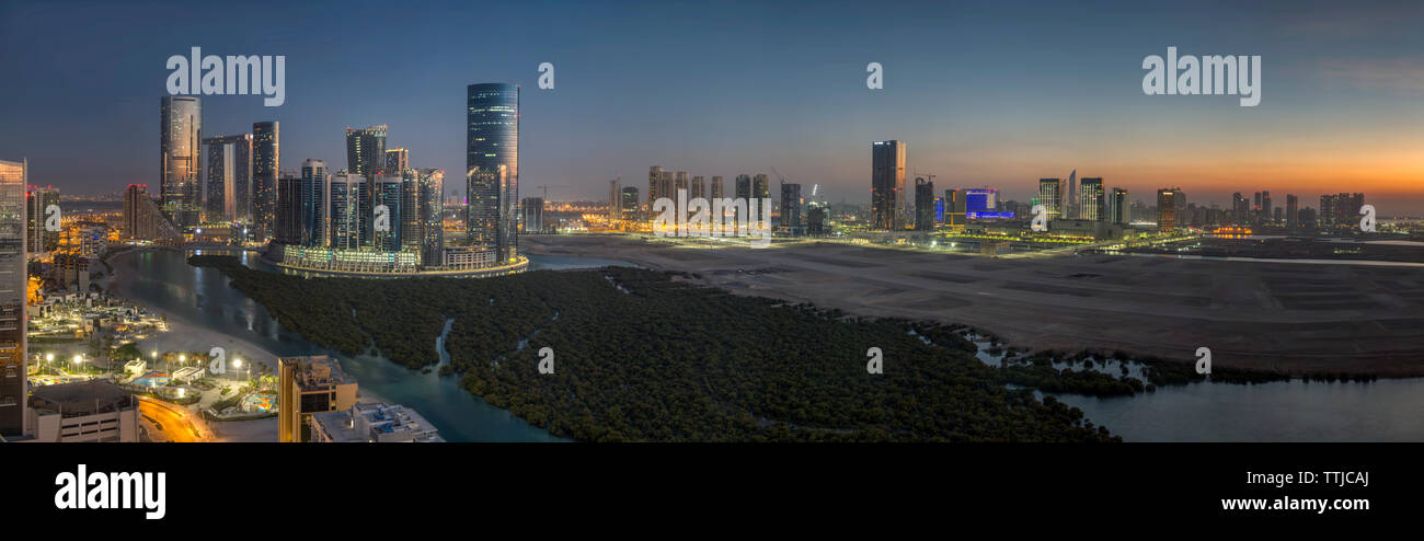 Sunset over City of Lights area of Reem Island in Abu Dhabi, UAE Stock Photo