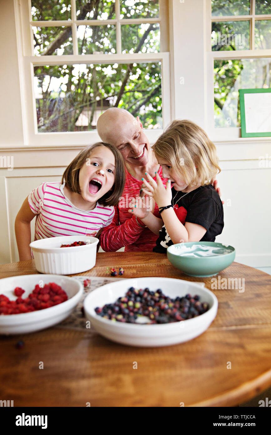 Happy children with mother at home Stock Photo
