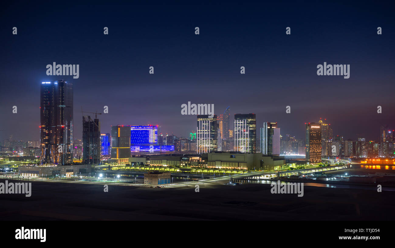 Sunset over City of Lights area of Reem Island in Abu Dhabi, UAE Stock Photo