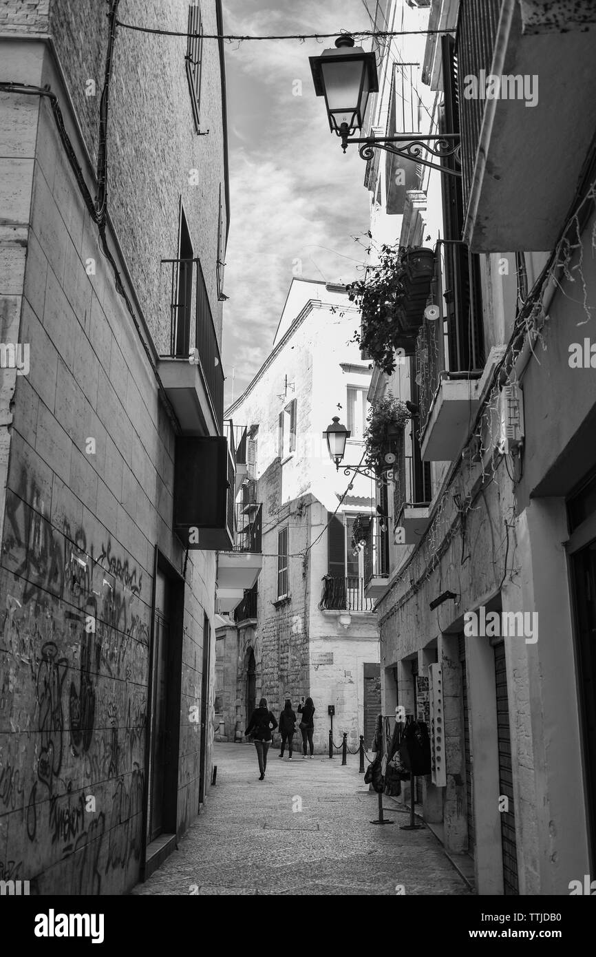 Typical picturesque narrow street in the Old Town of Bari, Puglia region, Southern Italy. Stock Photo