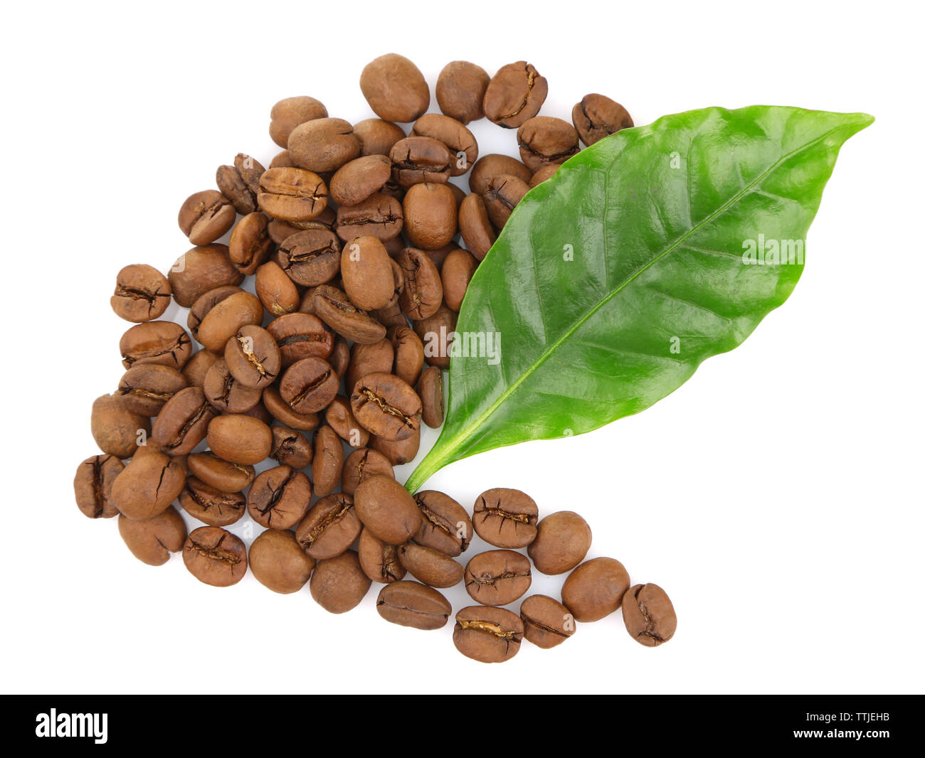 Coffee beans and green leaves, isolated on white Stock Photo - Alamy