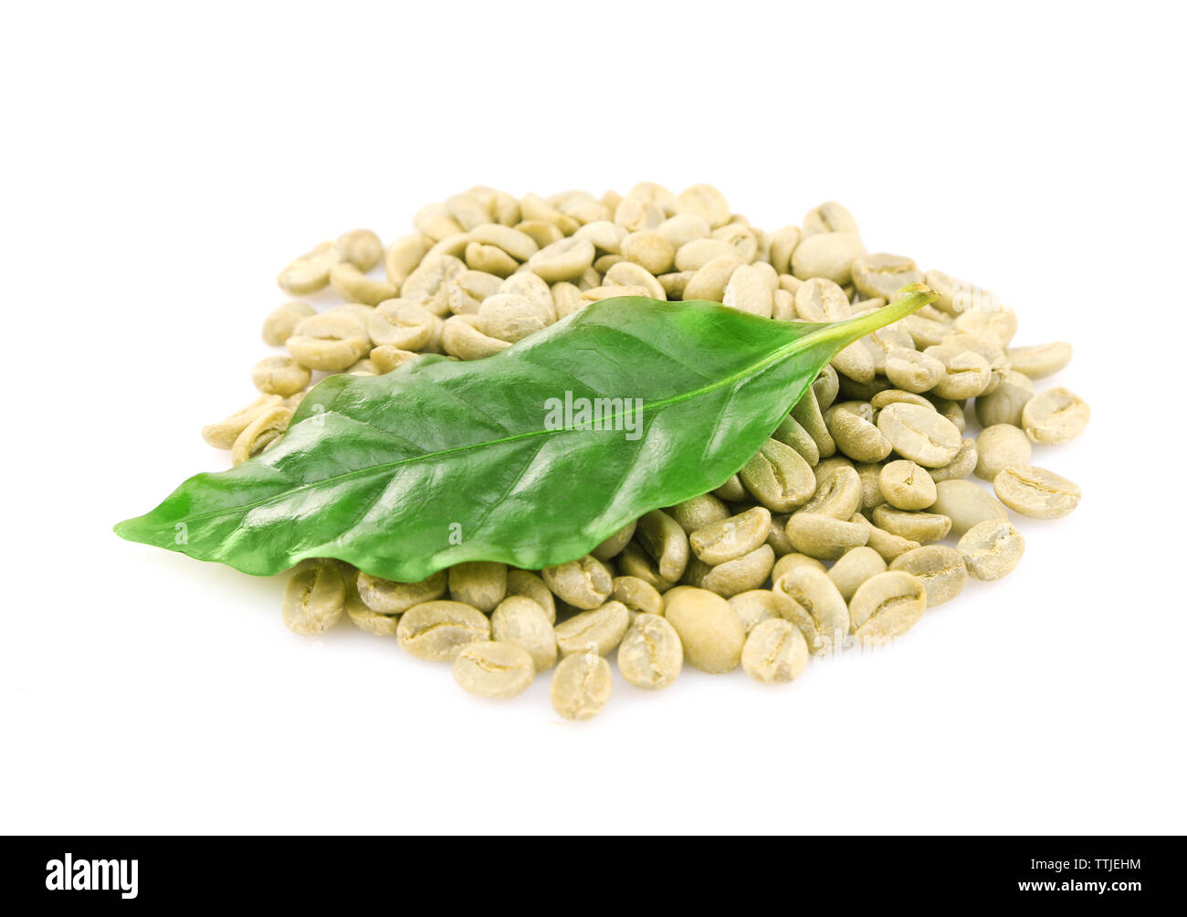 Coffee beans and green leaves, isolated on white Stock Photo - Alamy