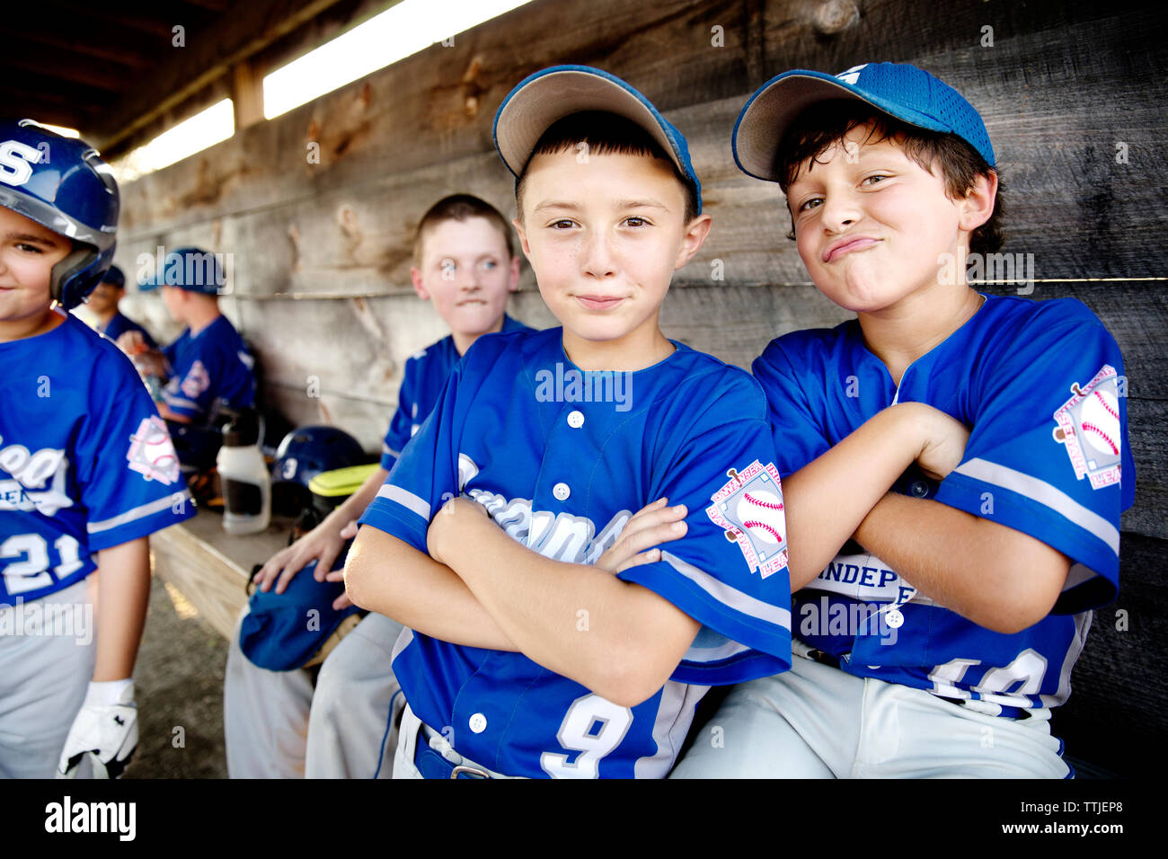 Portrait of happy baseball players in dugout Stock Photo Alamy
