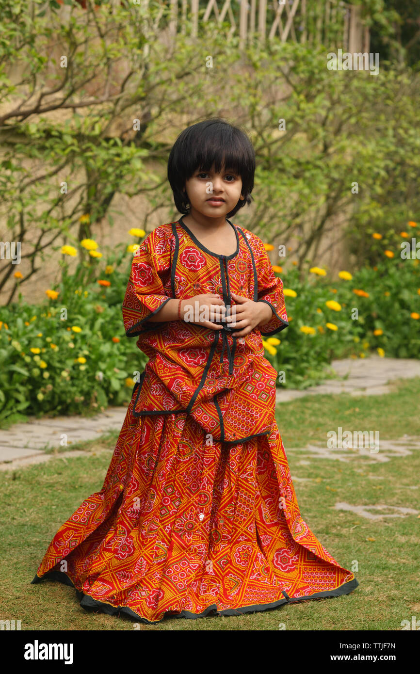 Portrait of a girl standing in a back yard Stock Photo