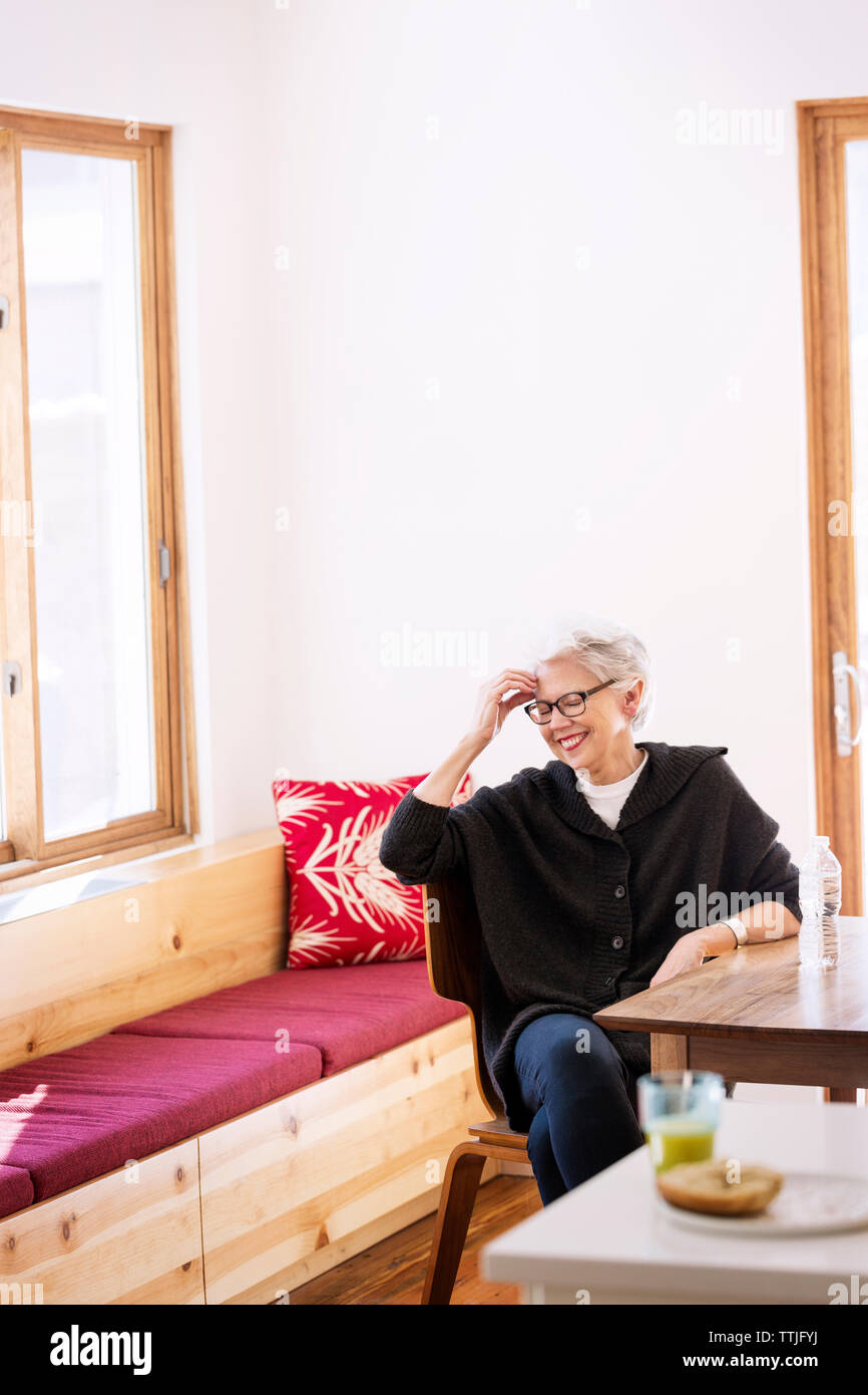 Woman sitting closed eyes sofa hi-res stock photography and images - Alamy