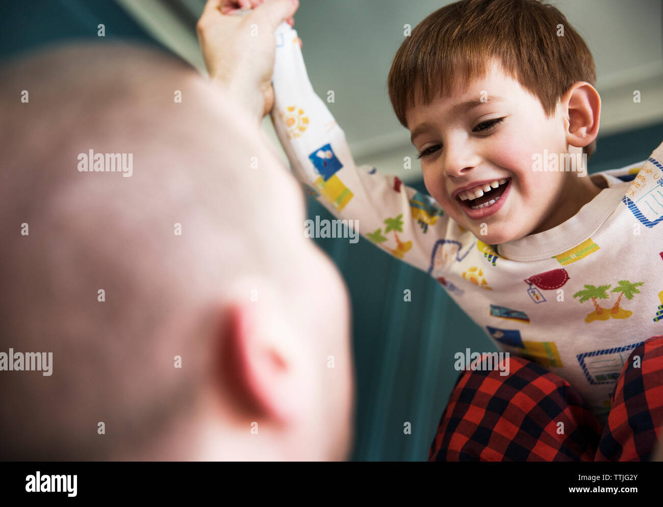 Child playing with father at home Stock Photo