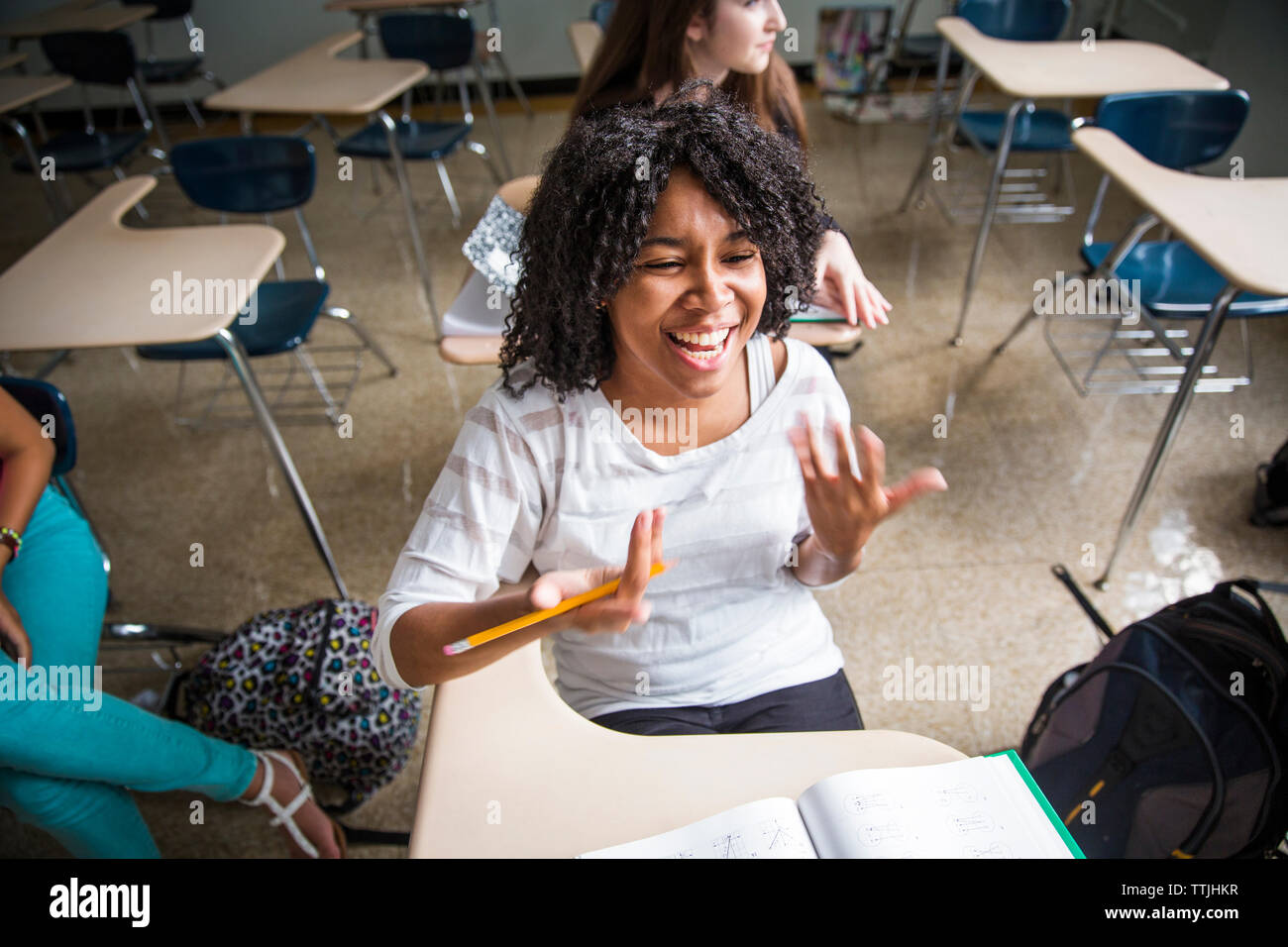 Girl laughing classroom hi-res stock photography and images - Alamy