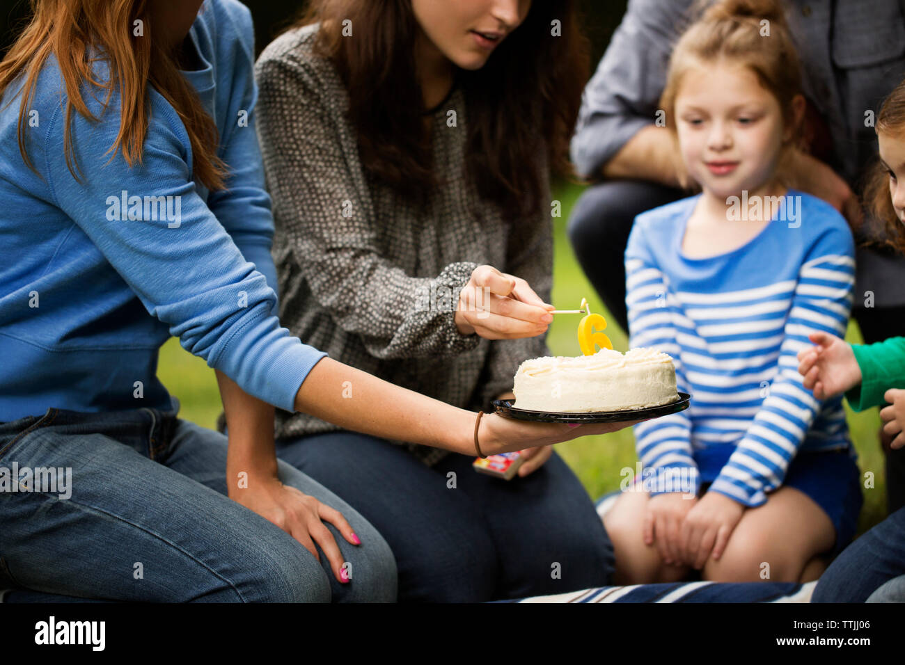 Old woman holding birthday cake hi-res stock photography and images - Alamy