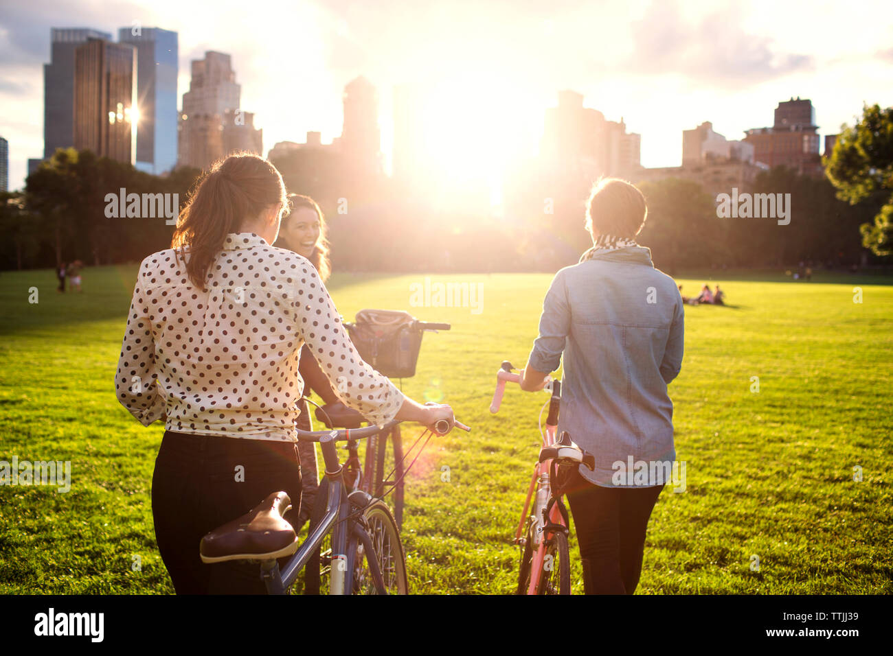 Rear view women cycling on hi-res stock photography and images - Alamy