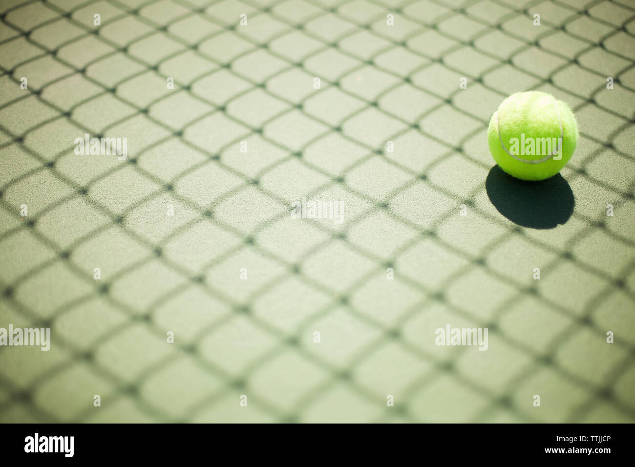 Tennis ball in court Stock Photo