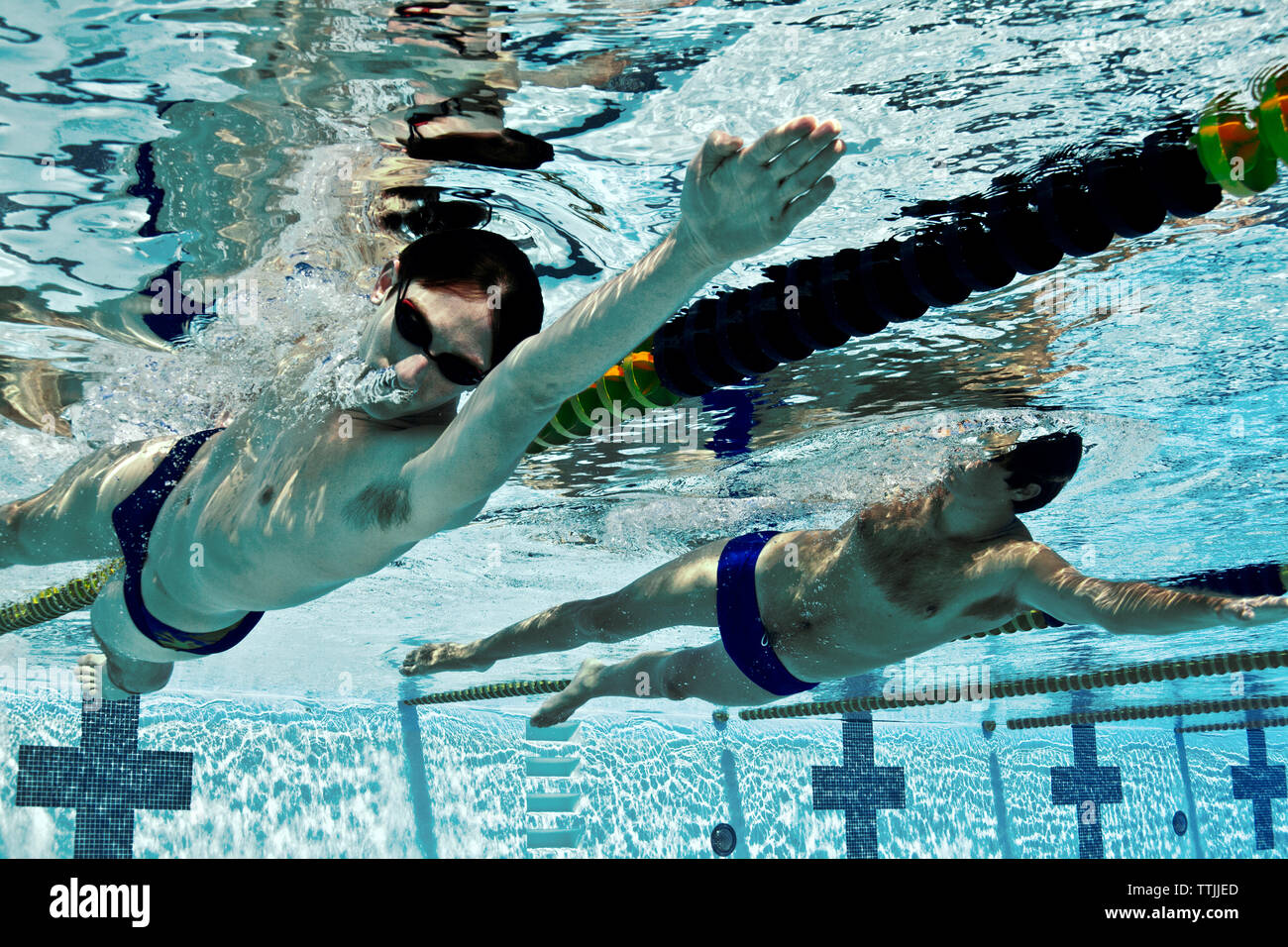 Men swimming in competition Stock Photo