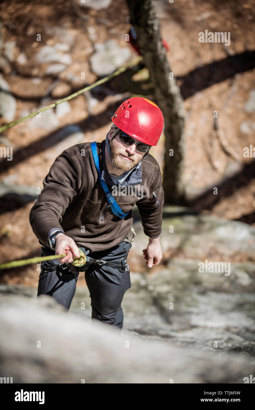 Man rappelling rock face hi-res stock photography and images - Alamy