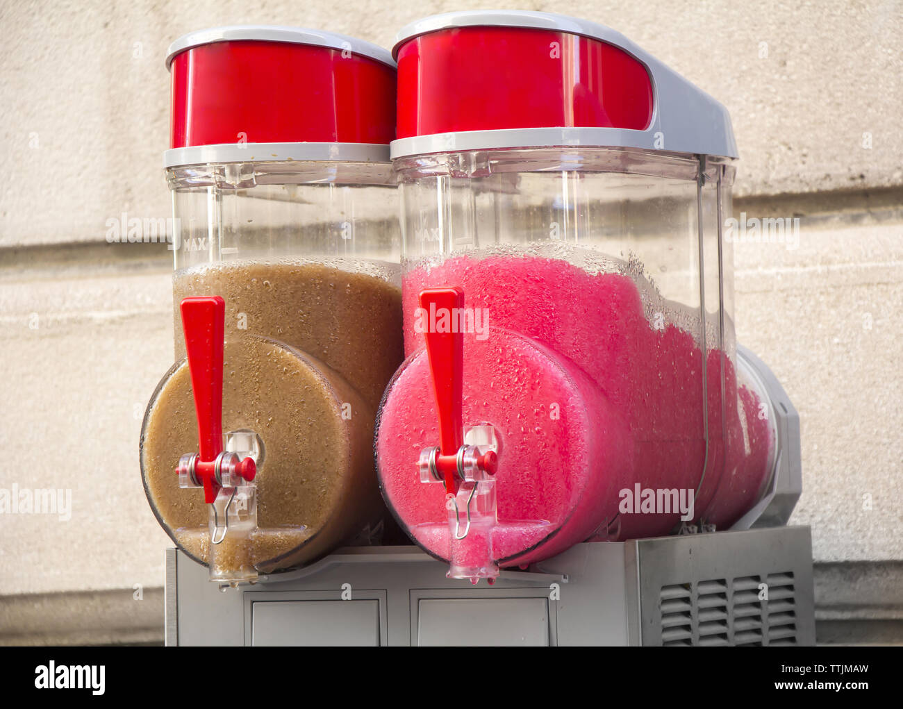 Two flavors of grenadine ice for sale on the street Stock Photo Alamy