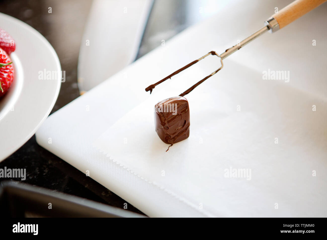 High angle view of food dipped in chocolate kept on tray Stock Photo
