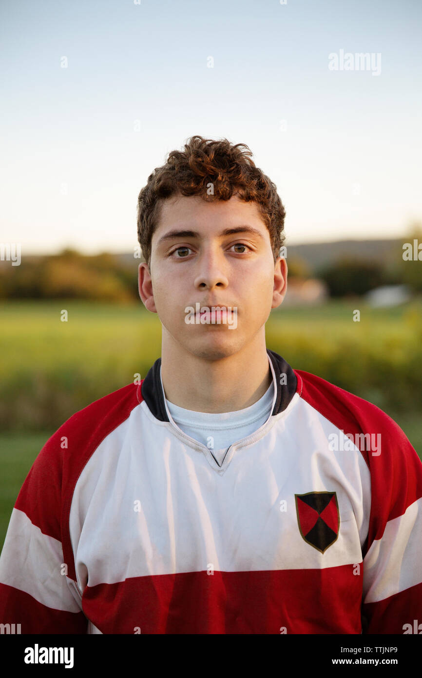 Portrait of male rugby player on field against clear sky Stock Photo