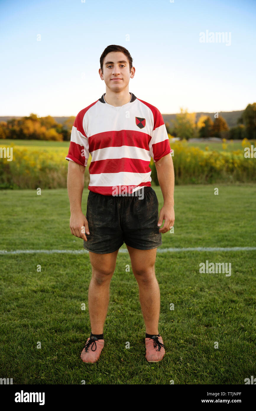 Full length portrait of rugby player standing on field Stock Photo
