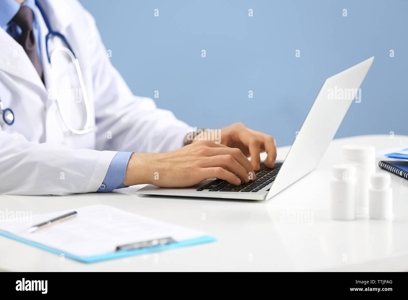 Doctor working on a computer in hospital Stock Photo - Alamy